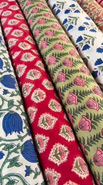 A spread of this season's hand blockprinted cottons, folded and laid out together